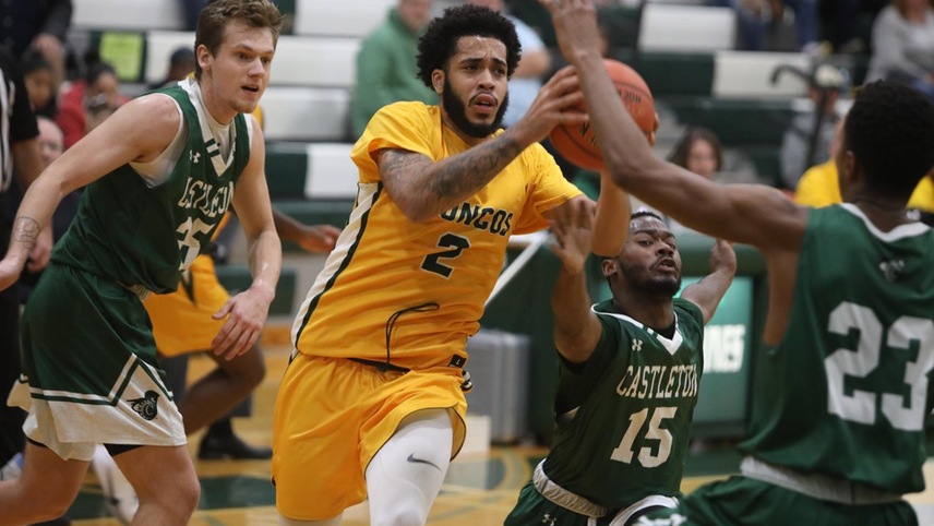 Justin Daoud #2 maneuvering through the defense about to pass the ball.