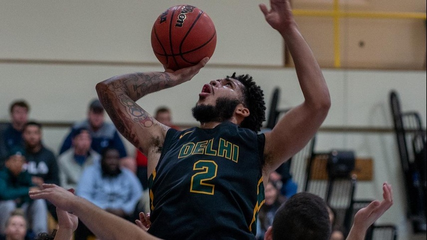 Justin Daoud #2 fights his way up for a layup.