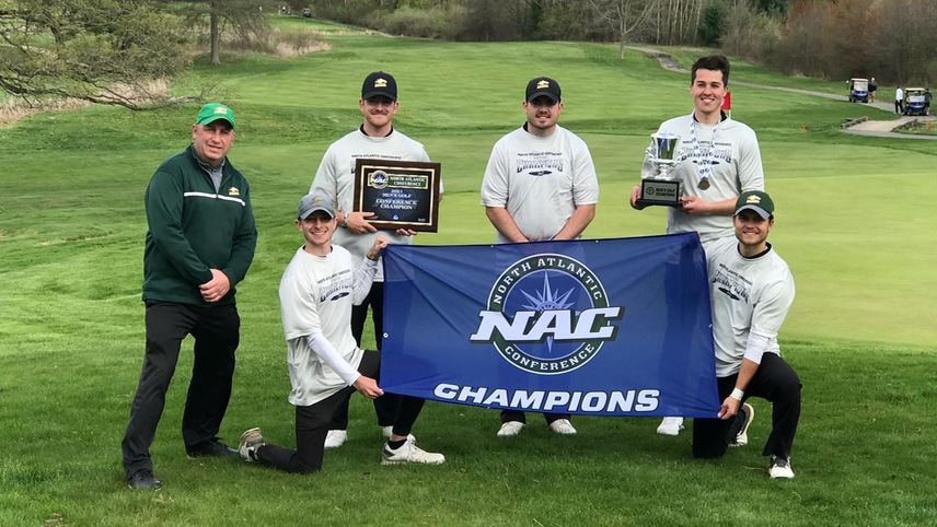 golf team holding championship banner