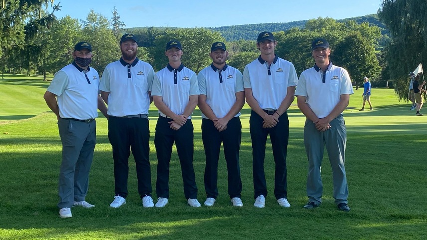 golfers posing for a photo