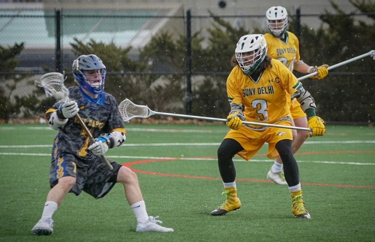 Delhi's Antonio Russo defending a Maine Maritime attacker in the Broncos' first NAC win on Saturday. 