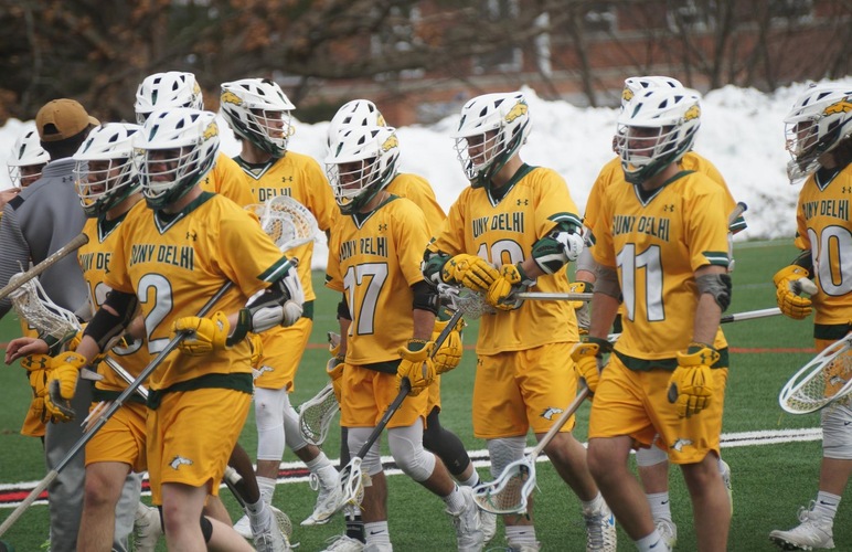 The SUNY Delhi men's lacrosse team walking off the field following a game.