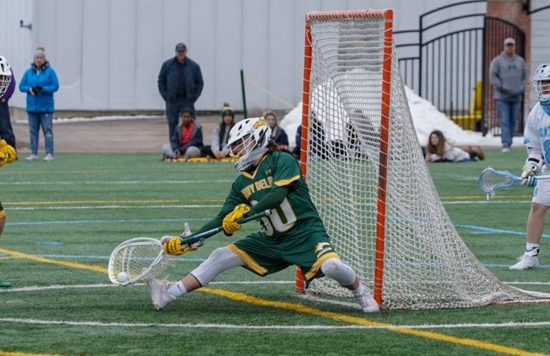 Goalie Travis Anderson saving a shot against Cazenovia.