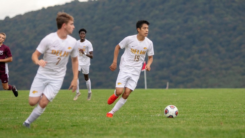 Emmanuel Gonzalez looking upfield with the ball in front of him.