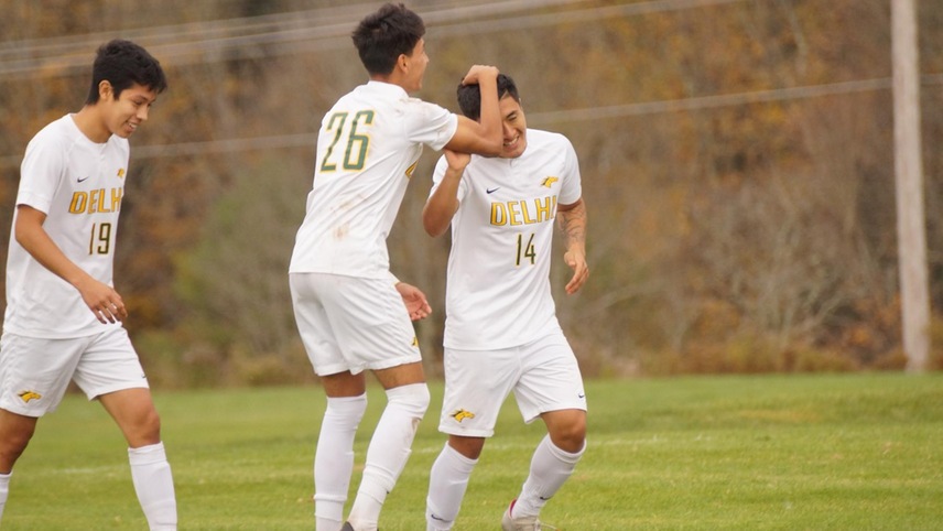 Juan Velez and Christian Quinde celebrating after teaming up for a goal.