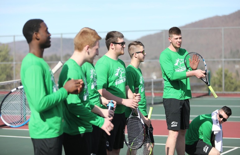 The men's tennis team during their pregame lineups.