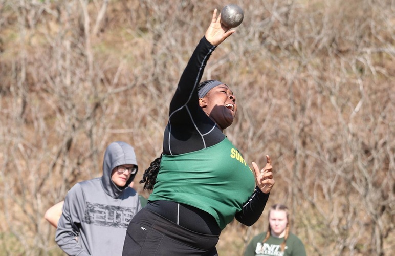 Diana Echols releasing the shot put. 
