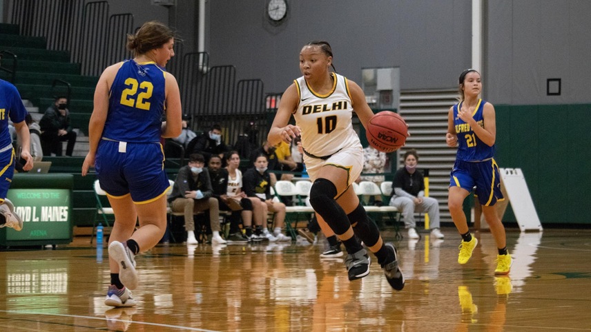 basketball player driving the ball up court
